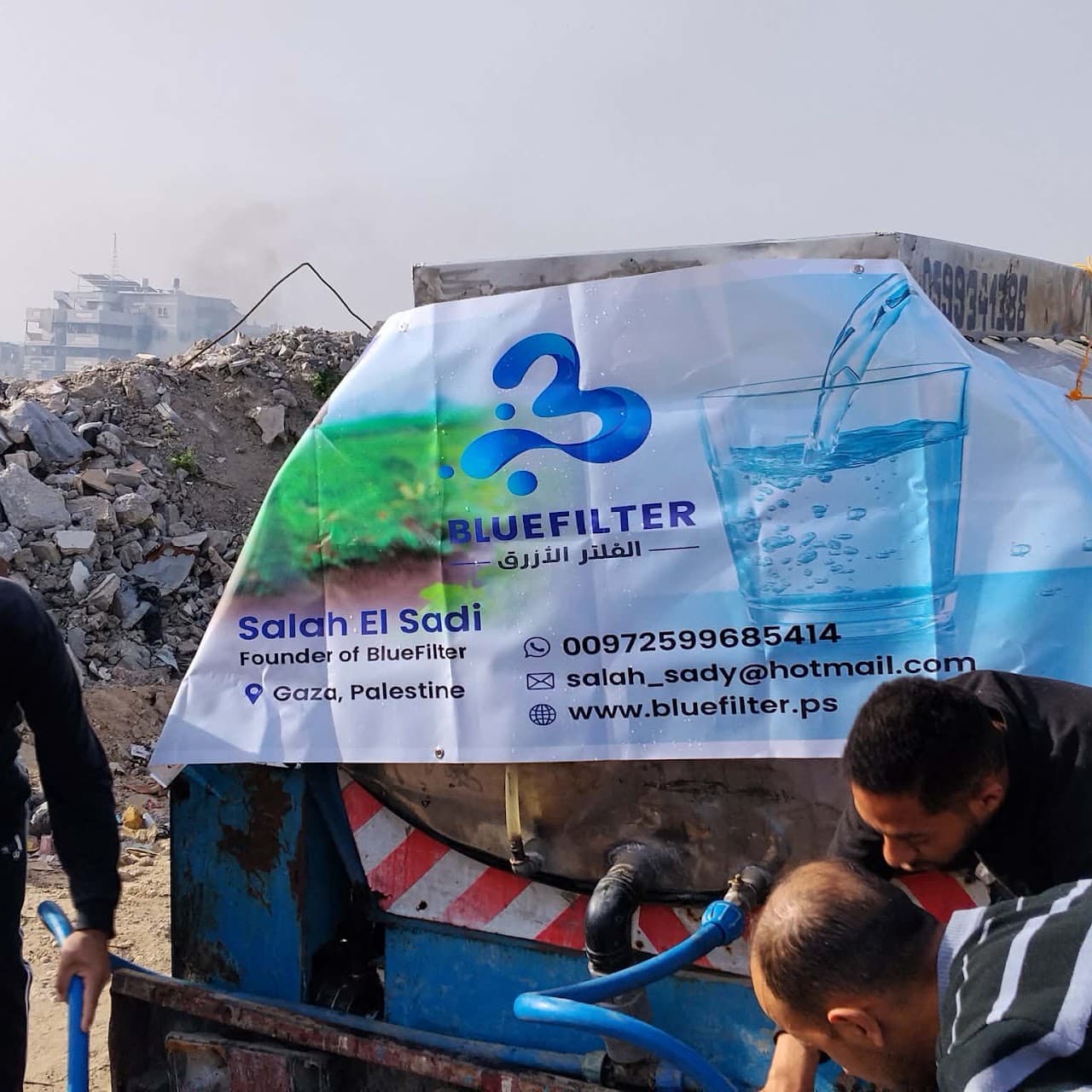 Blue Filter water tanker distributing purified drinking water in Gaza